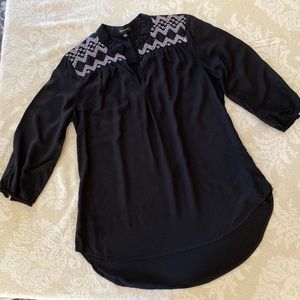 Black tunic type top with white trim